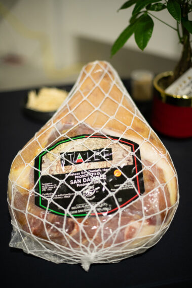 Prosiutto cheese wrapped in a packaged displayed on a table.