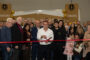 Vicken Aghchikian cutting a red ribbon at the their Grand Opening.