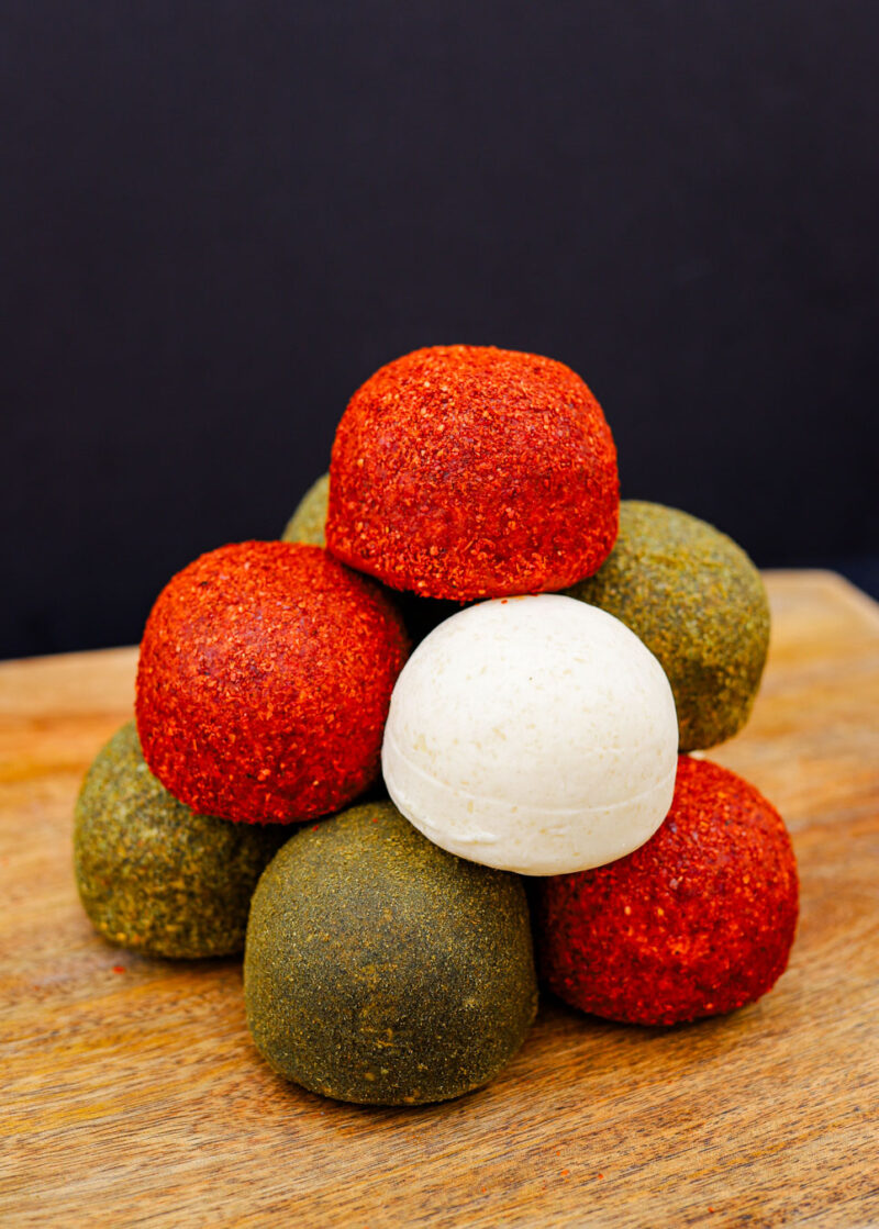 Feta cheese balls stacked like a tower.