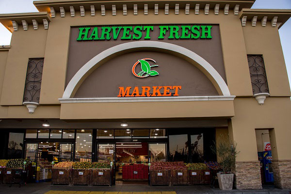 Exterior picture of Harvest Fresh Market front of building.